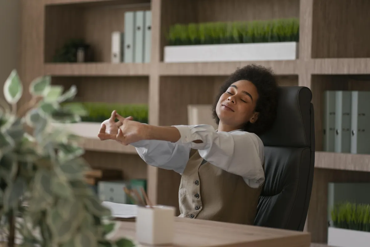 A licensed nurse stretching in an office setting.