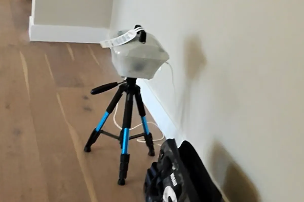 Radon testing in Queen Creek Arizona showing continuous radon monitor set up inside home during real estate inspection period