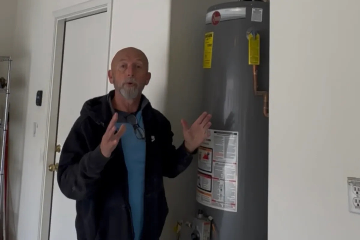 New homeowner bootcamp in Queen Creek Arizona with home inspector explaining water heater maintenance and essential home systems to first-time buyers