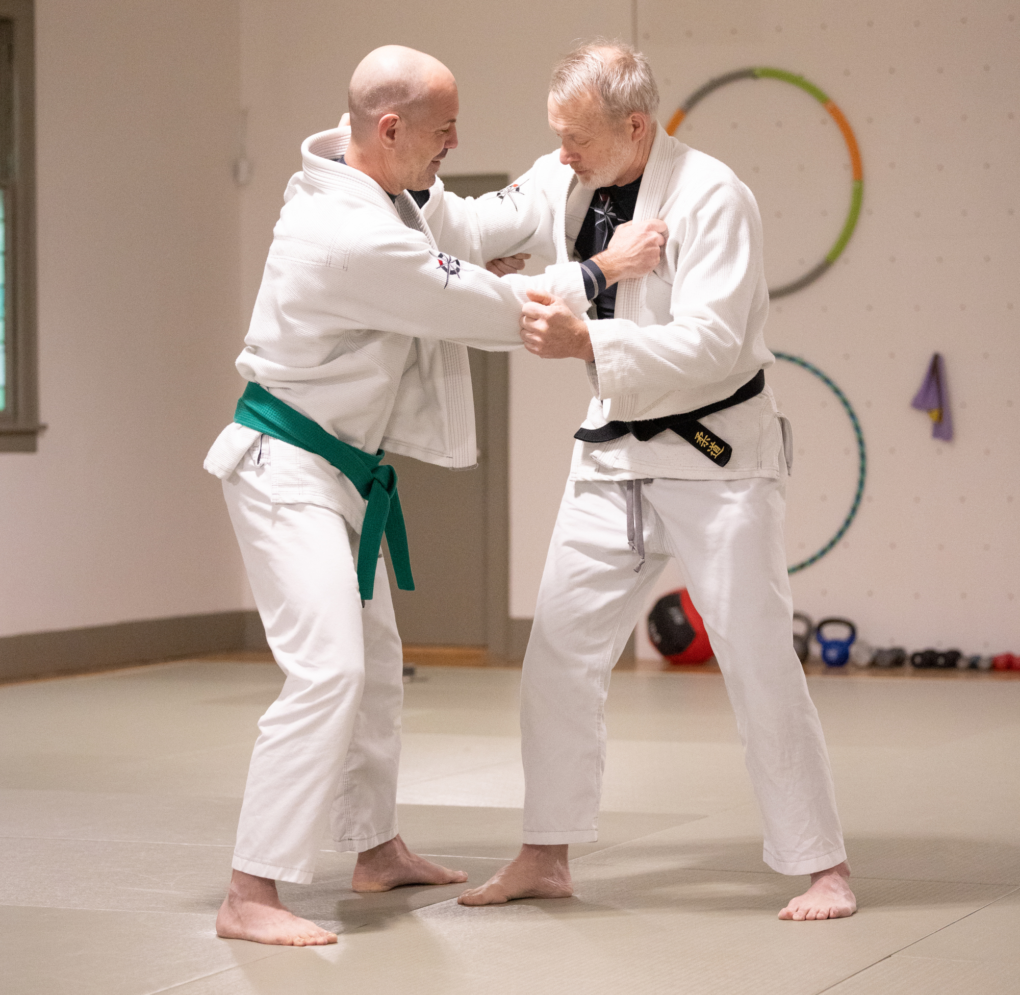 two men doing karate inside room