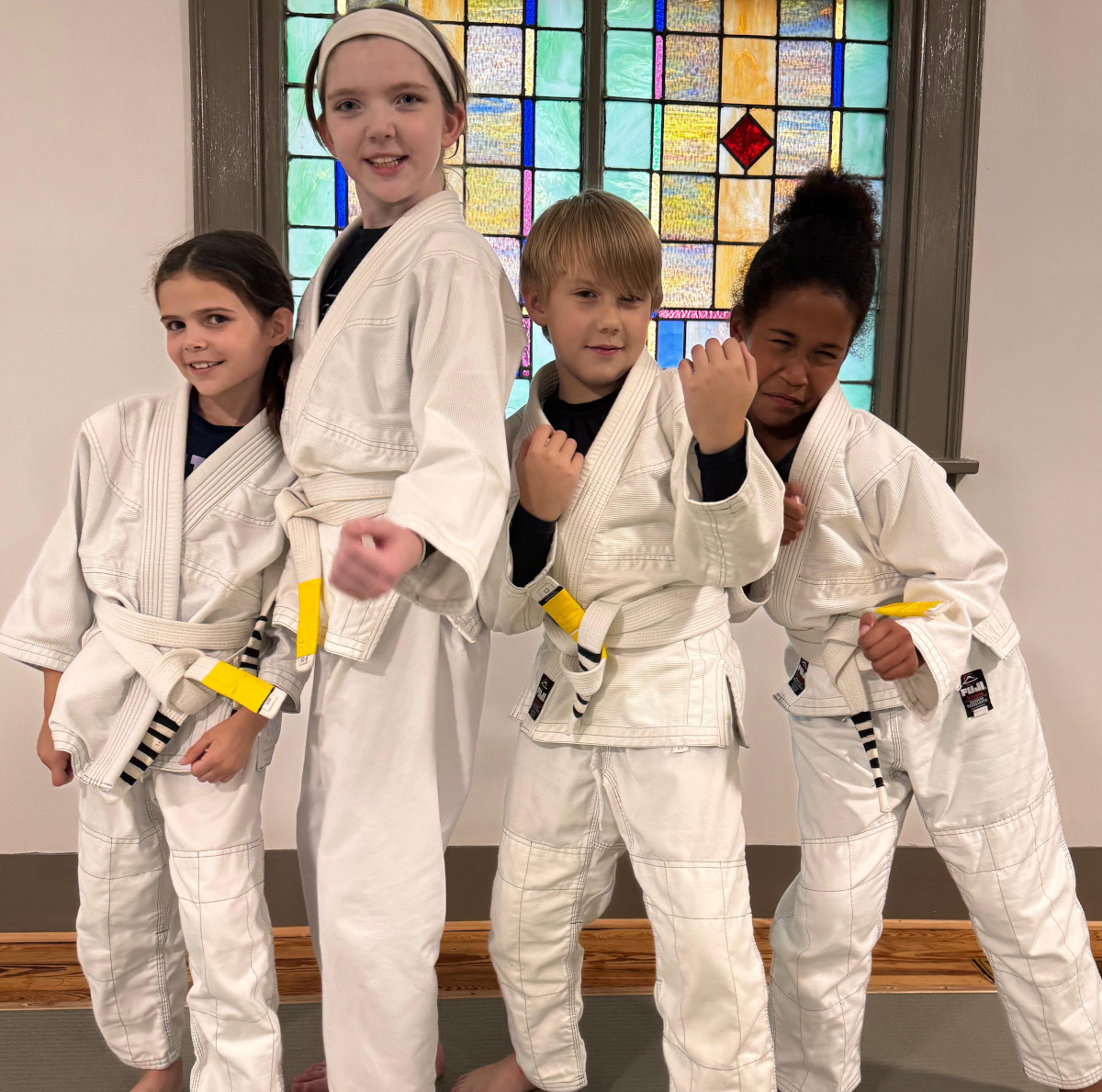A group of men practicing karate in front of a building
