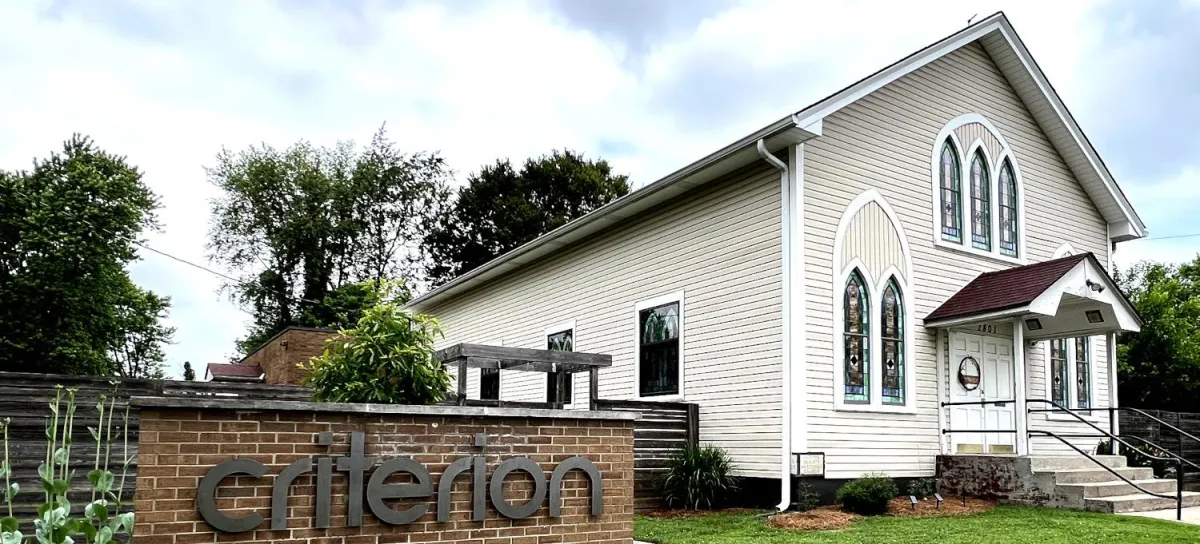 a group of people standing in a room
