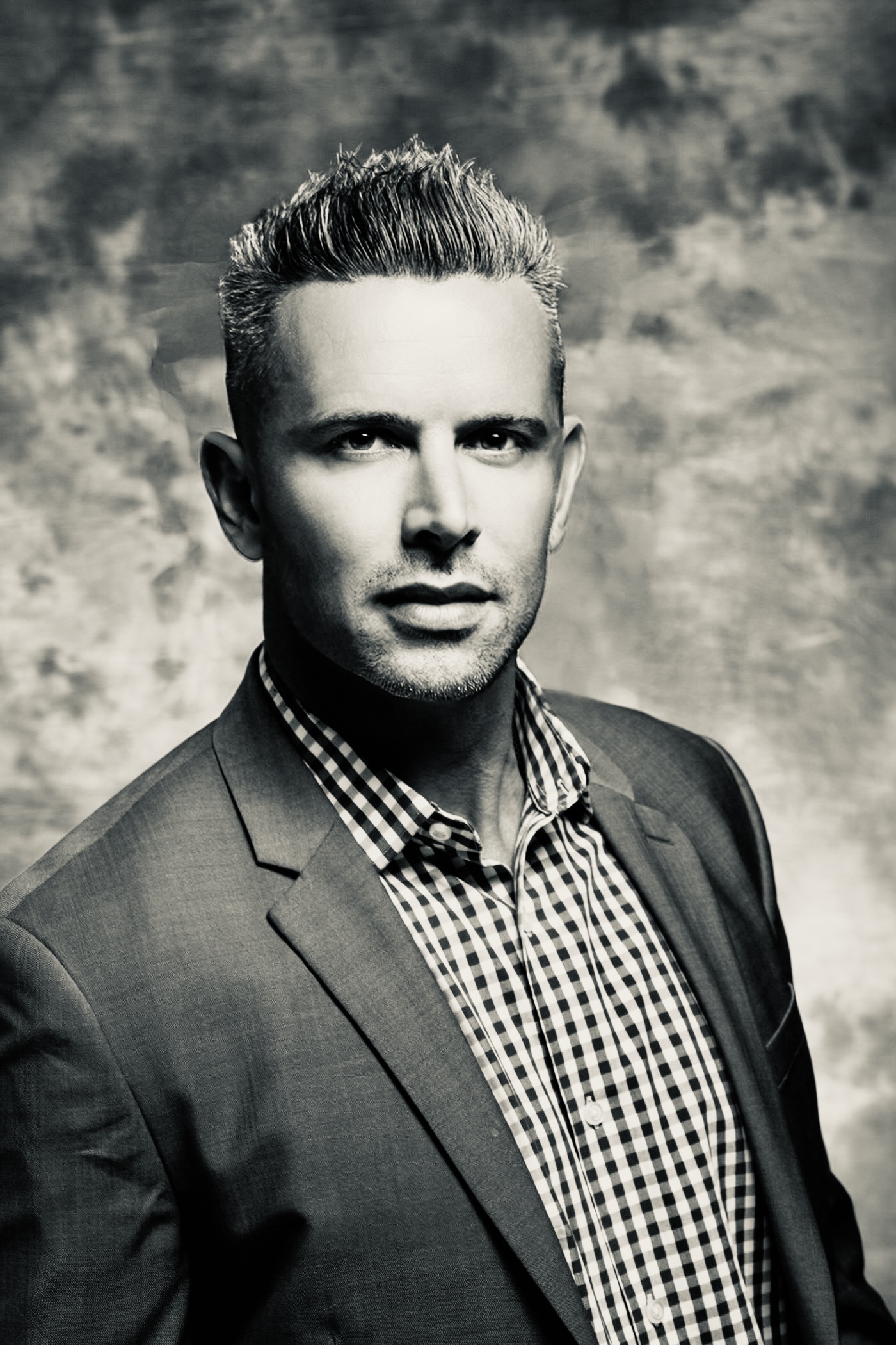 Cinematic warm-toned hero portrait with left negative space for text