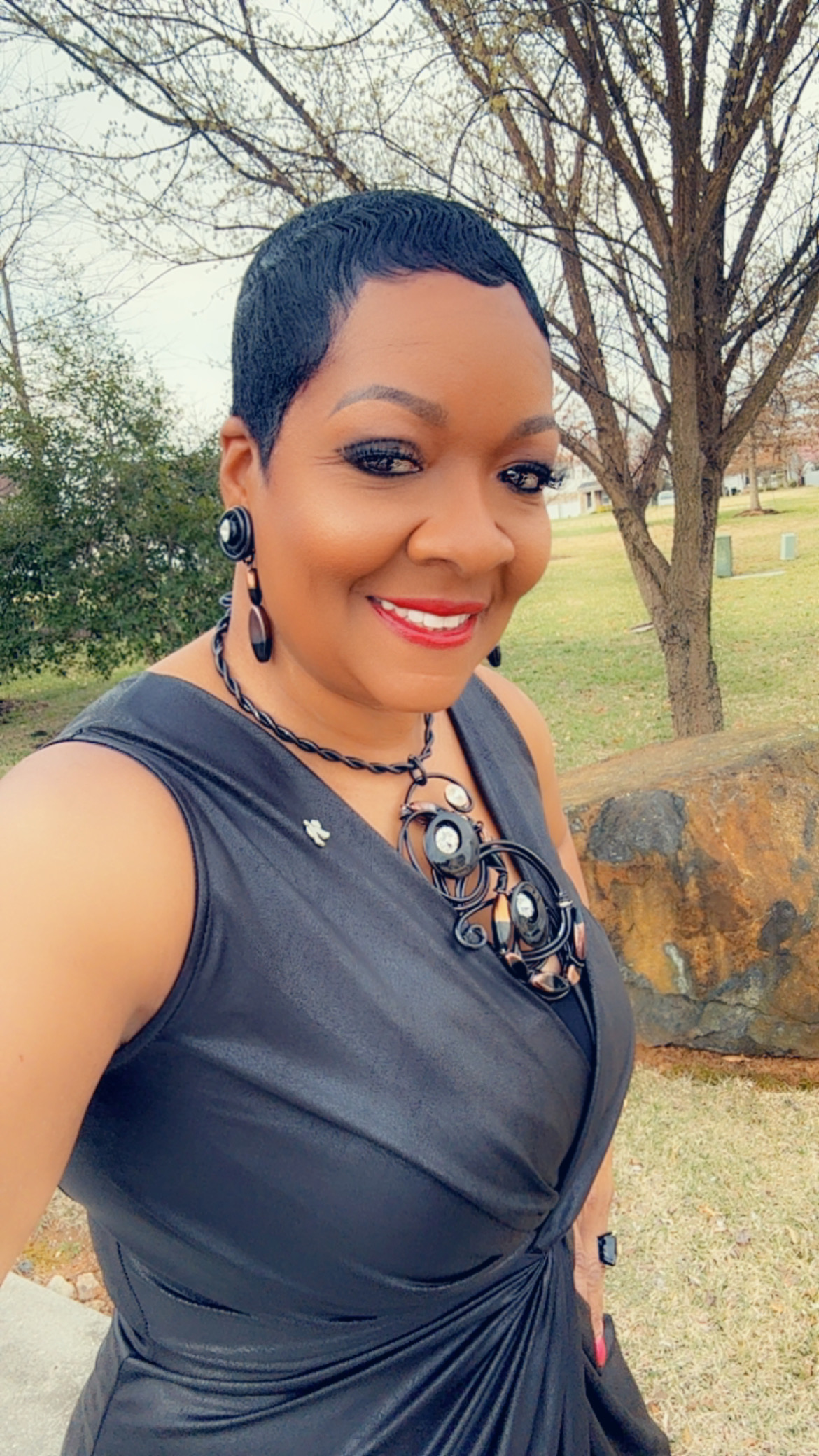 Smiling close-up of Phyllis Brown Brewer, elegant and approachable