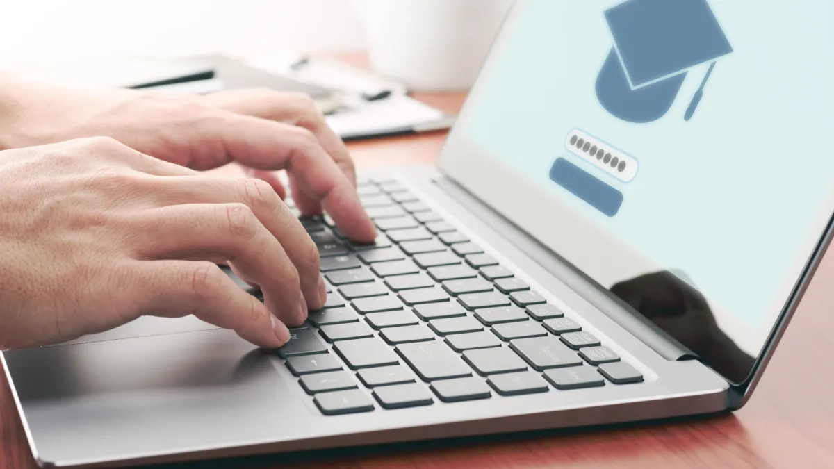 four people watching on white MacBook on top of glass-top table