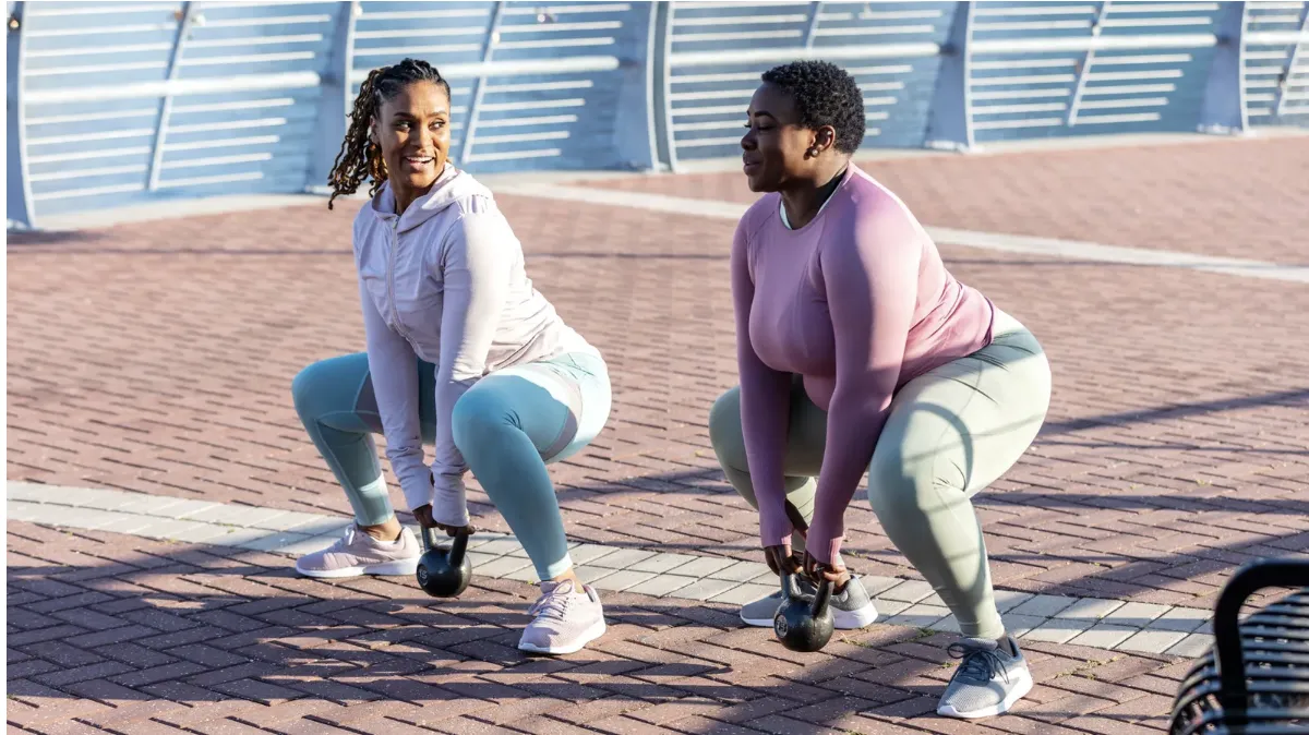a boxing ring with a pair of boxing gloves hanging from the ceiling