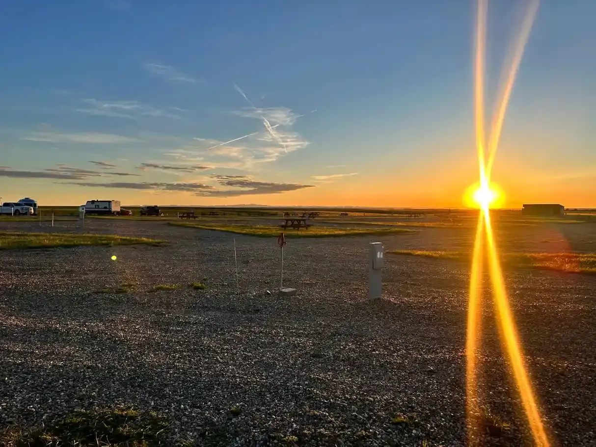 Sunset over the prairie from SOBO's Campground featuring spacious RV sites and colorful South Dakota skies.