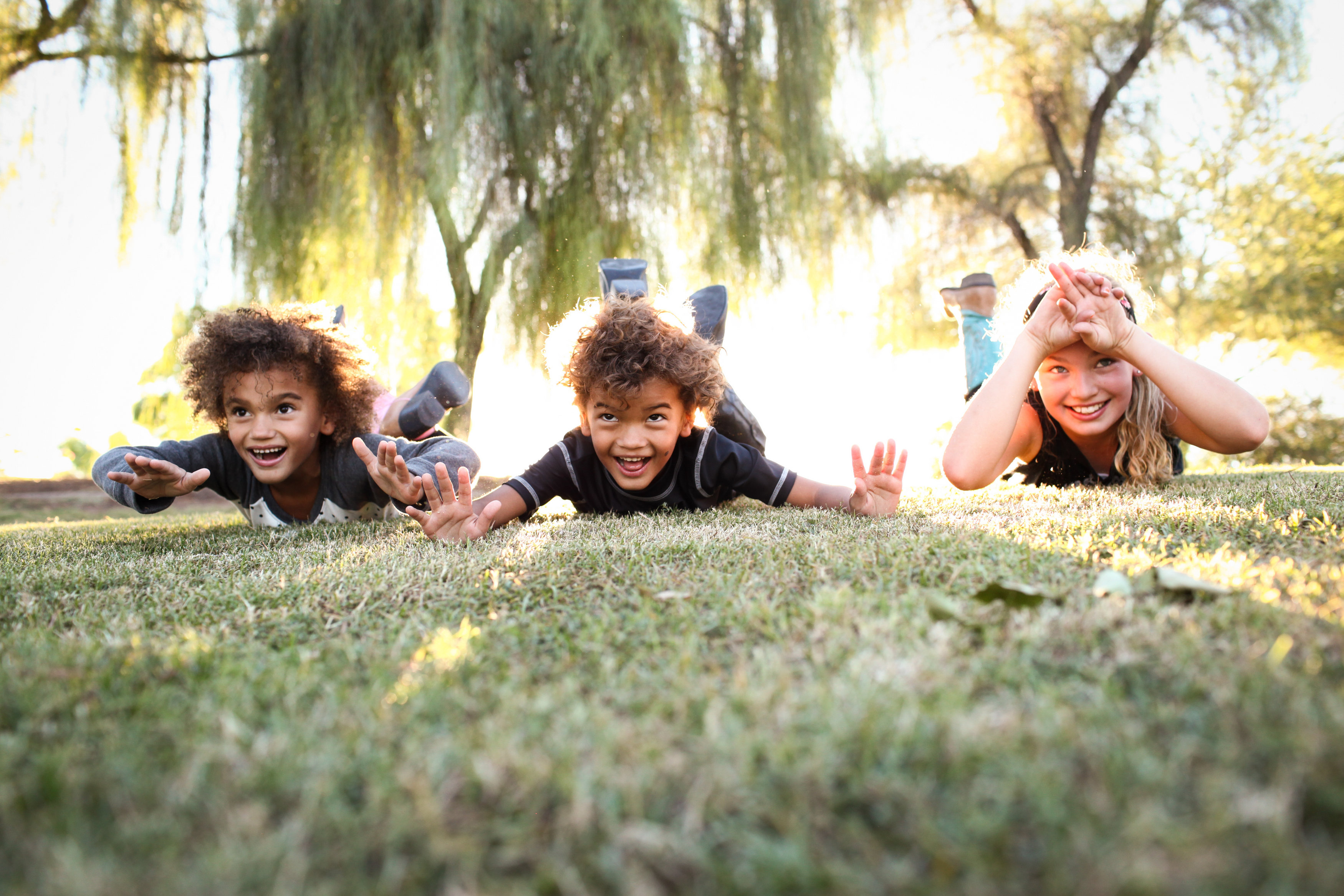 Dr. Carlson's 3 young children doing supermans