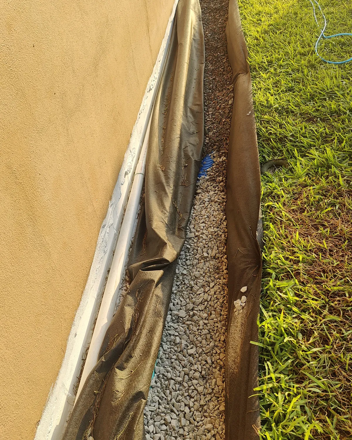 A Trufam French drain installation in a Tampa Bay yard