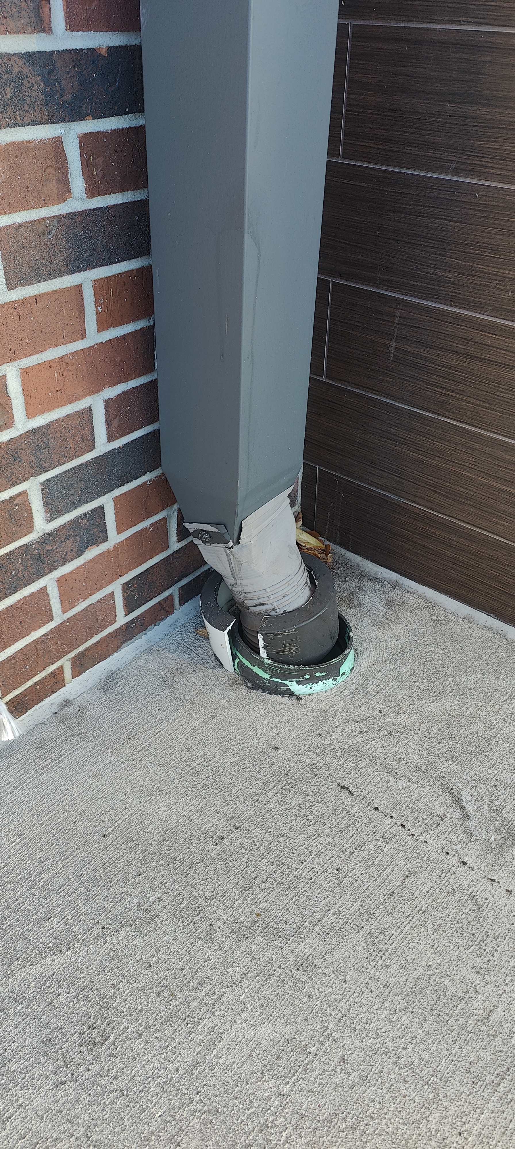 The Commercial Downspout Bottleneck That Floods Buildings