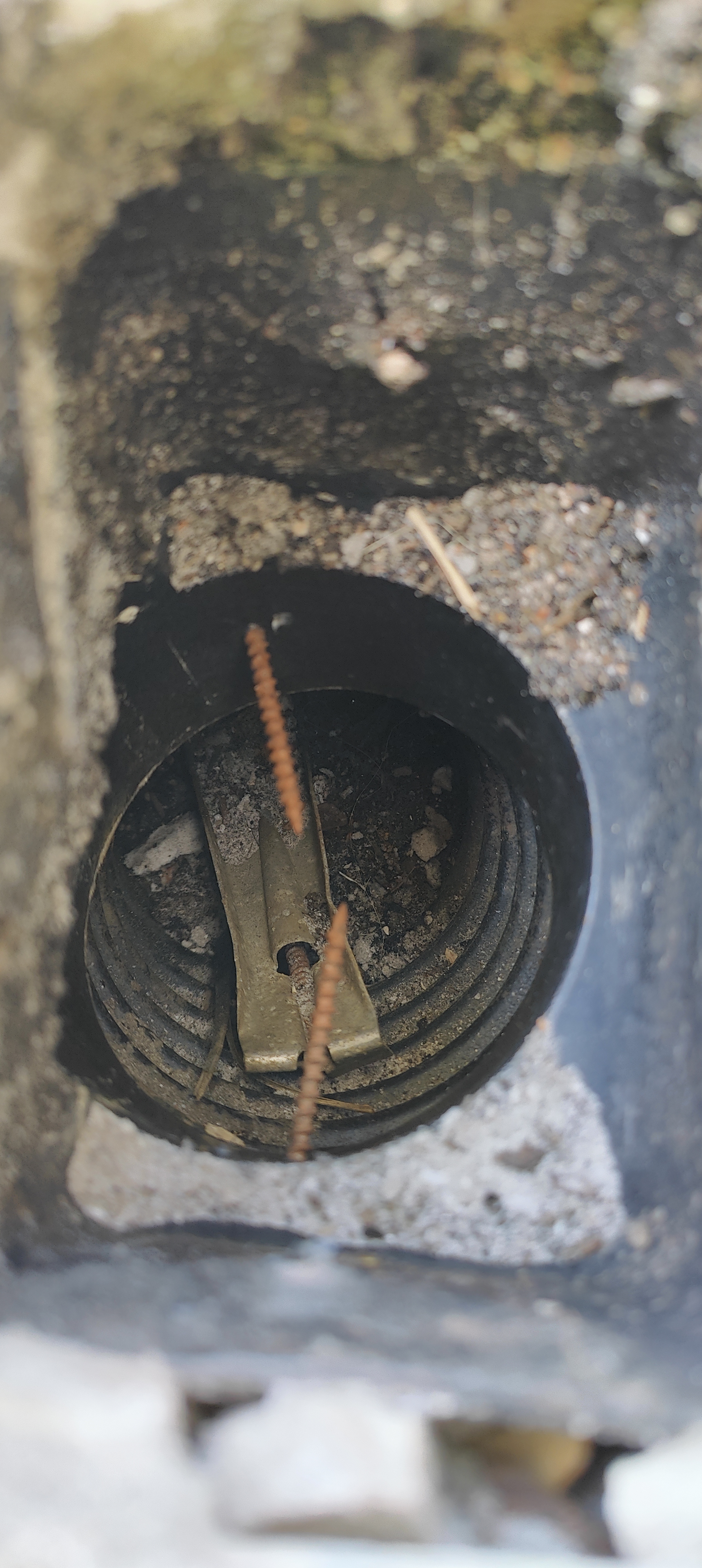 The Buried Downspout Disaster Under These Pavers