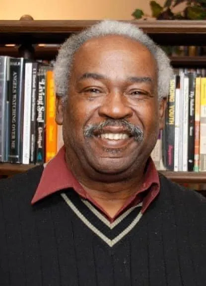Archival portrait of Dr. Emory Joel Tolbert in scholarly attire
