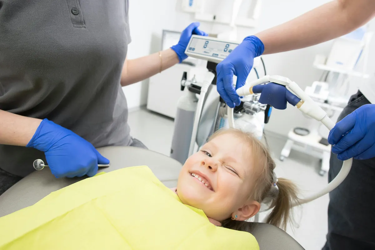 child smiling at dentist office 