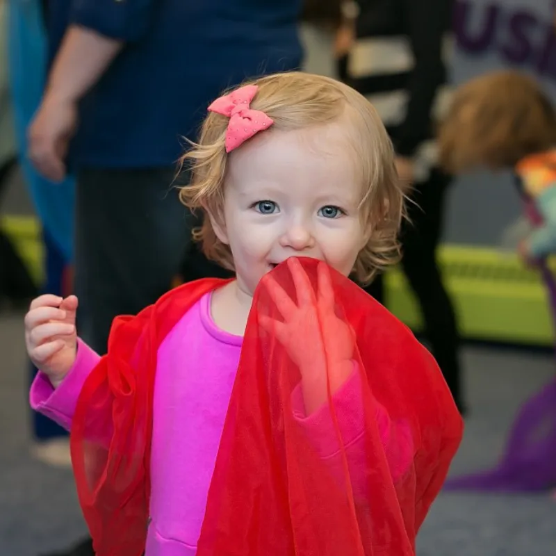 selective focus silhouette photography of man playing red-lighted DJ terminal