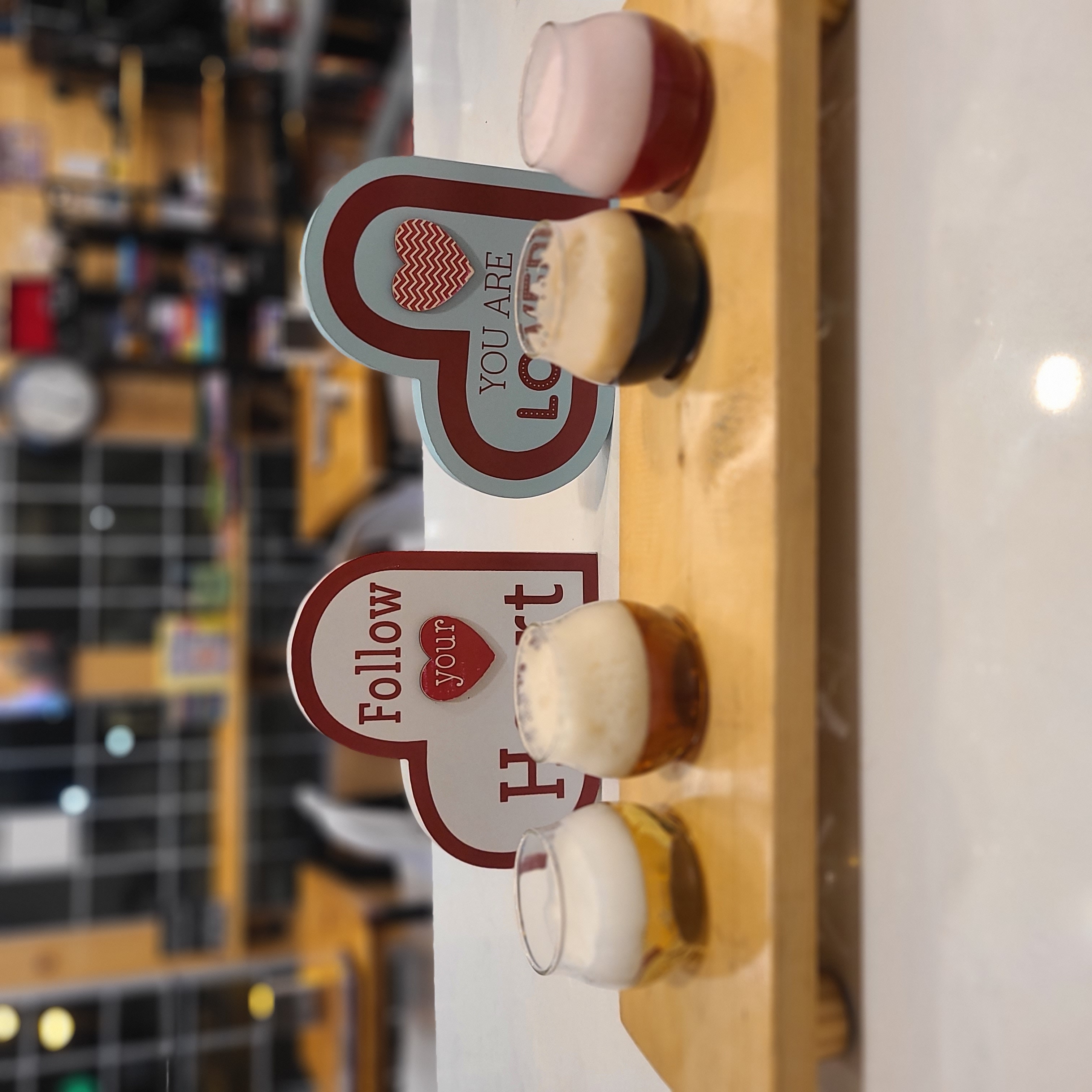 A guest being poured a First Pour tasting flight at 2nd Wind Brewery