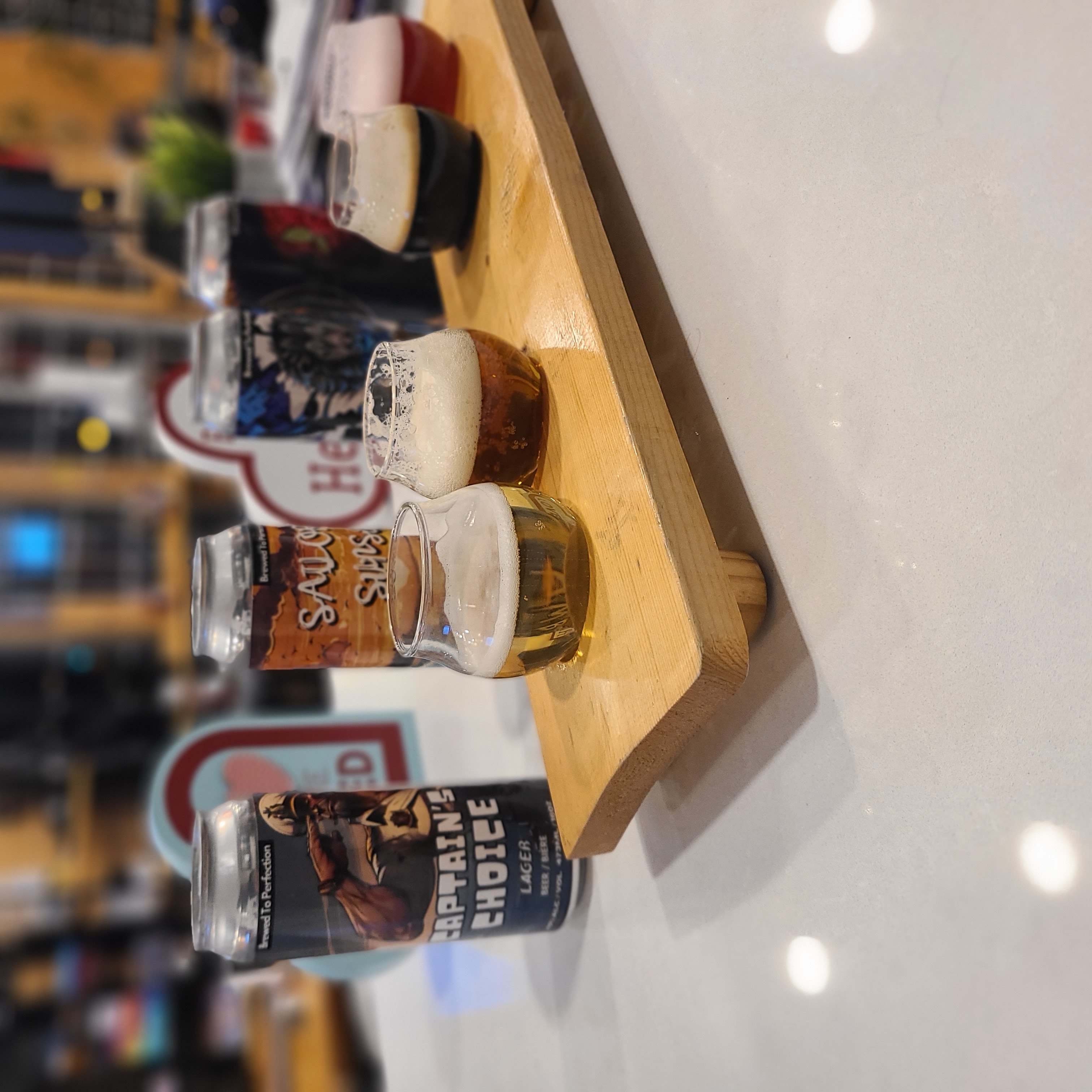 A tasting checklist and flight of beers at 2nd Wind Brewery and Eatery