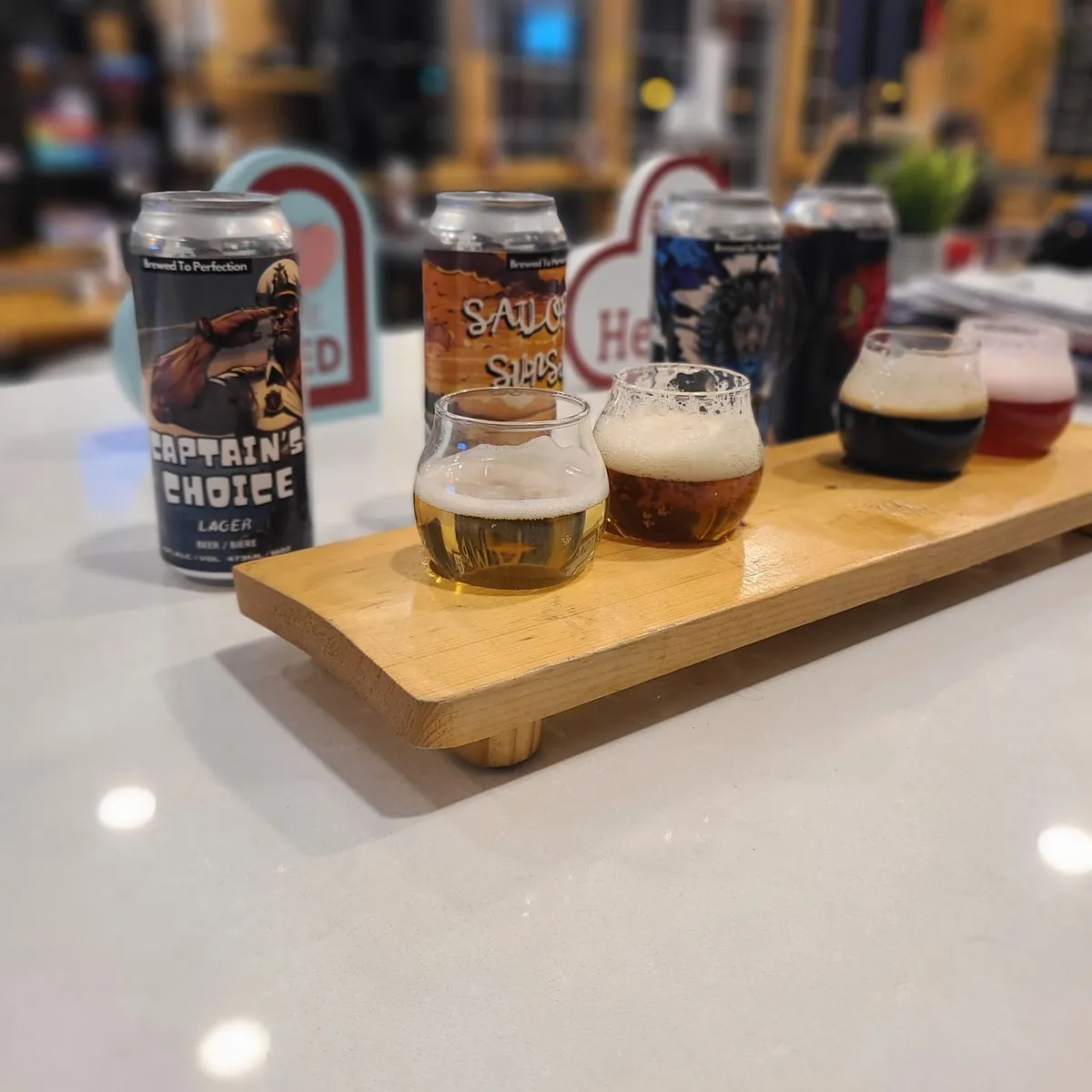 A tasting checklist and flight of beers at 2nd Wind Brewery and Eatery