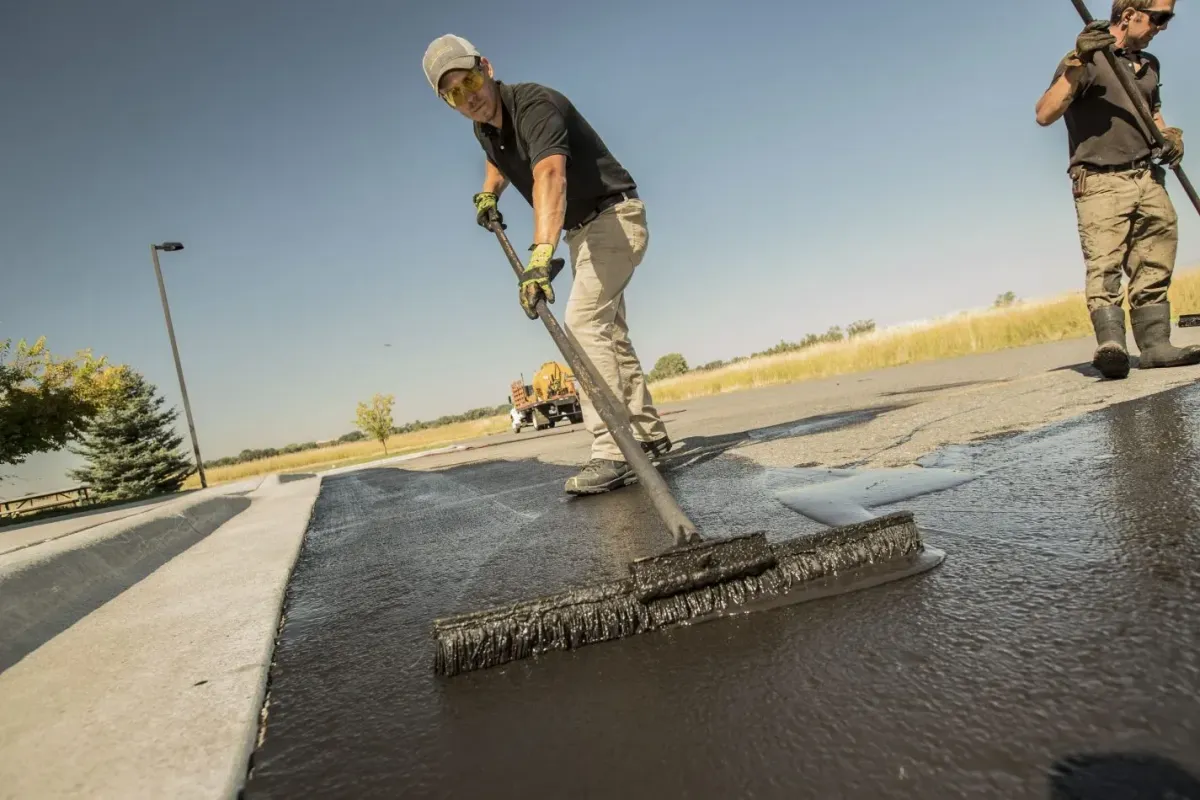 Applying professional-grade sealcoating to protect and extend the life of asphalt pavements in Langley.