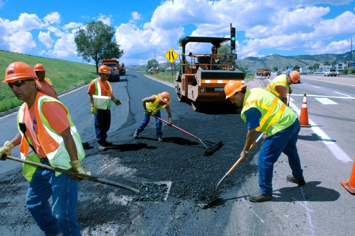 Our experienced asphalt paving team in action, committed to delivering excellence in every project.