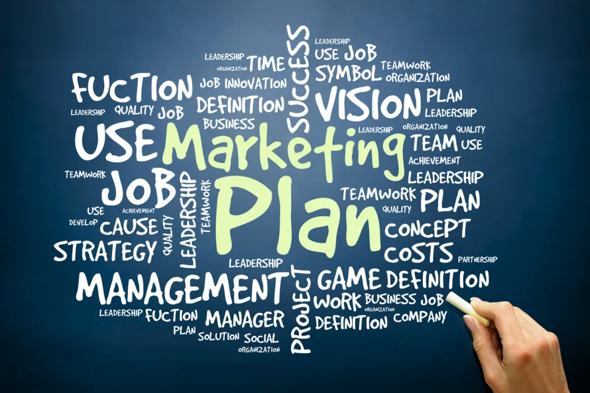 A red victorian house with a porch.