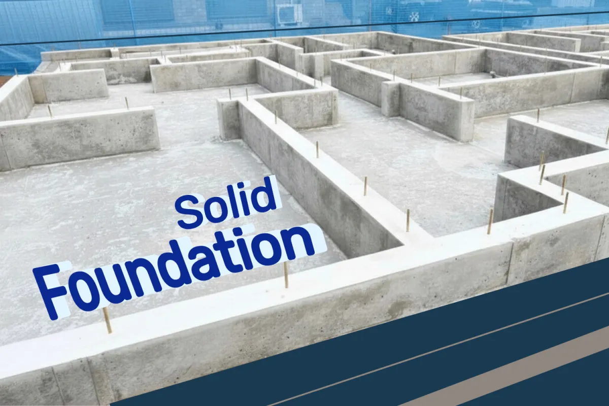 a couple of chairs sitting on top of a cement floor