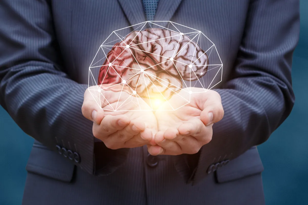A red victorian house with a porch.