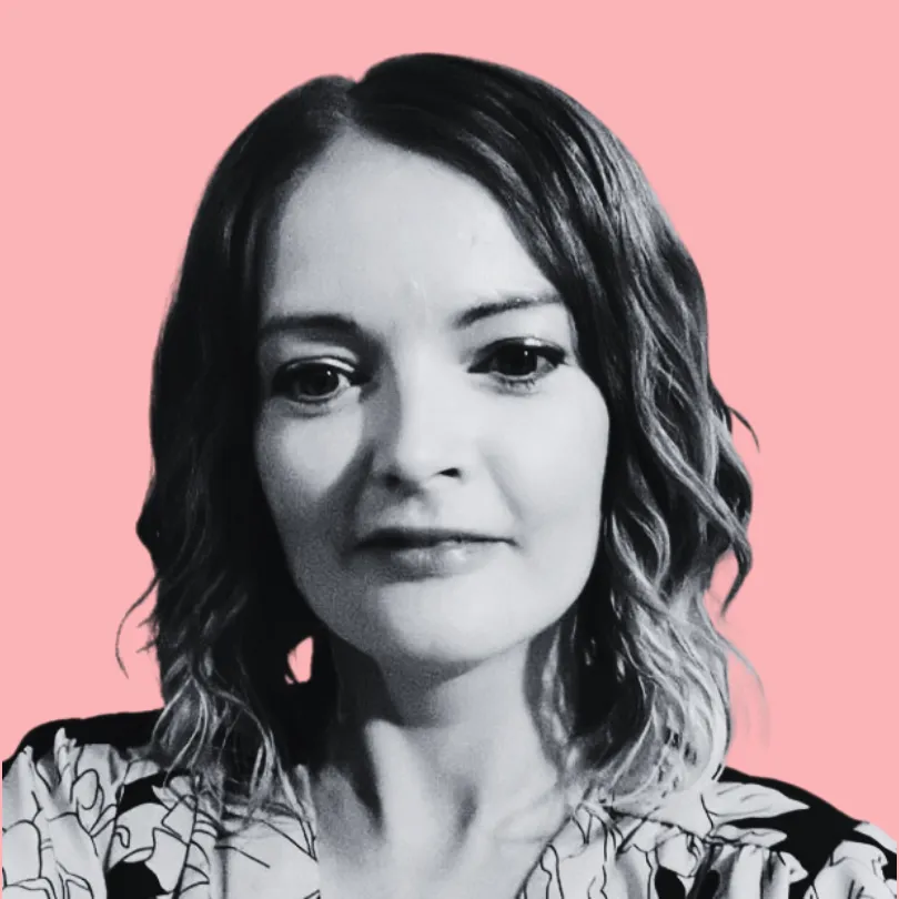 LisaJackson, Sheldon Social, in a patterned shirt, facing the camera, on a peach background