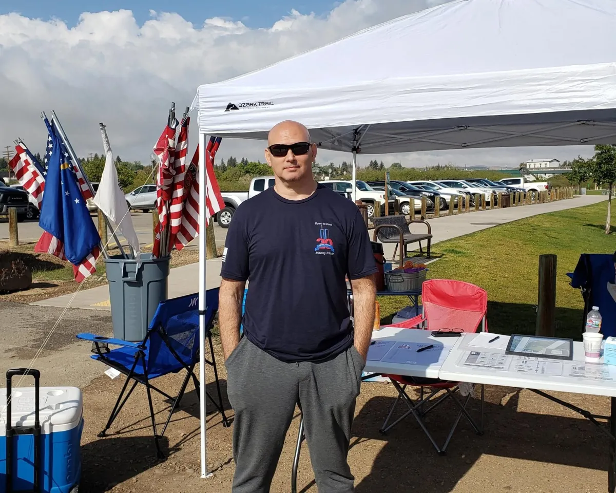 Volunteer tent set up for the 9/11 Dawn to Dusk Moving Tribute check-in
