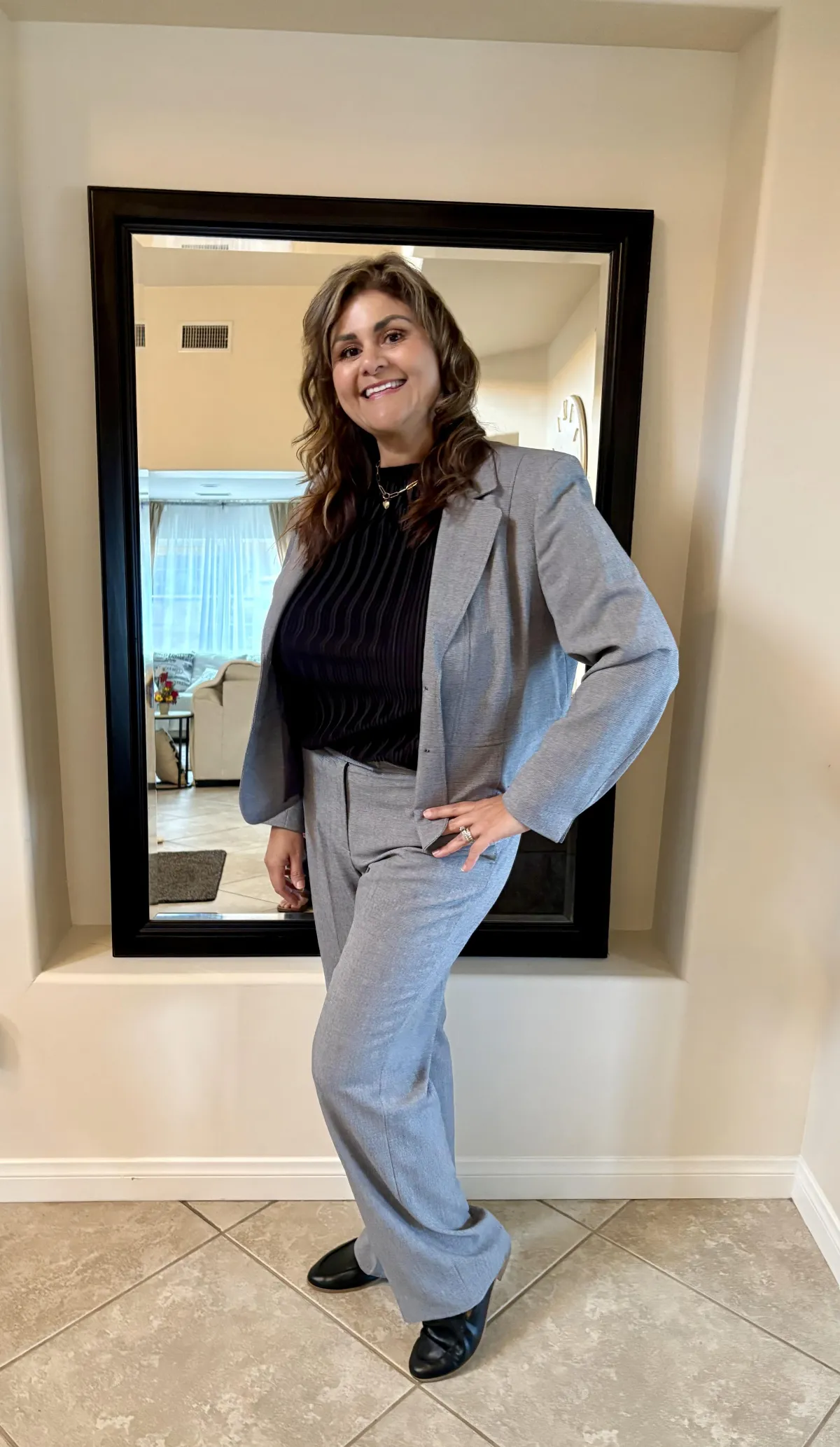 short-haired black cat besides brown wooden table