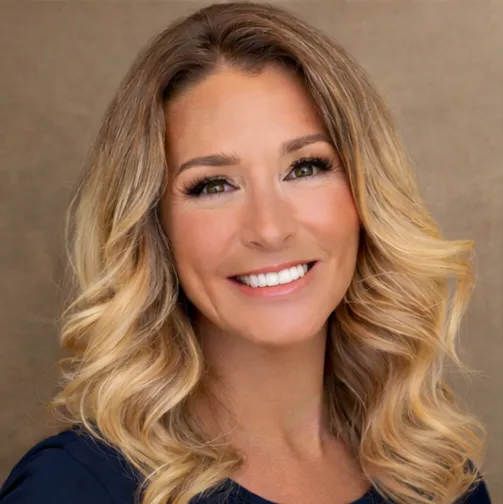 Headshot avatar of a smiling 30-something woman