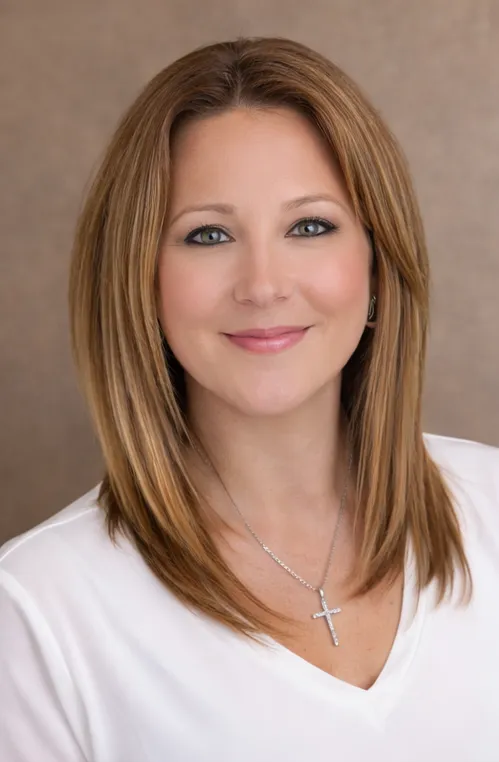 Headshot avatar of a smiling 30-something woman