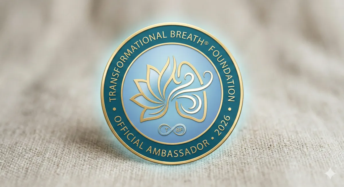Official 2026 Transformational Breath Foundation Ambassador digital badge. A circular teal and gold seal featuring a lotus flower integrated with flowing breath lines, the TBF infinity logo, and the text 'Transformational Breath Foundation Official Ambassador 2026'.