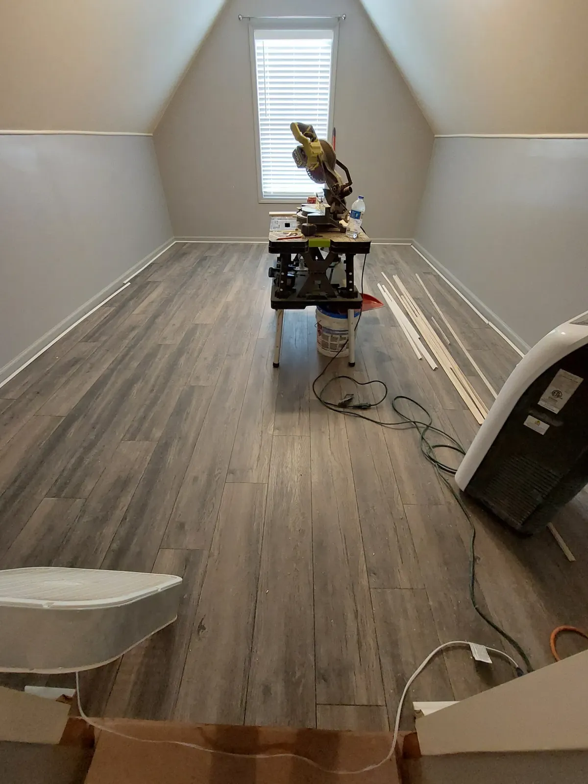 Finished attic conversion with plank flooring