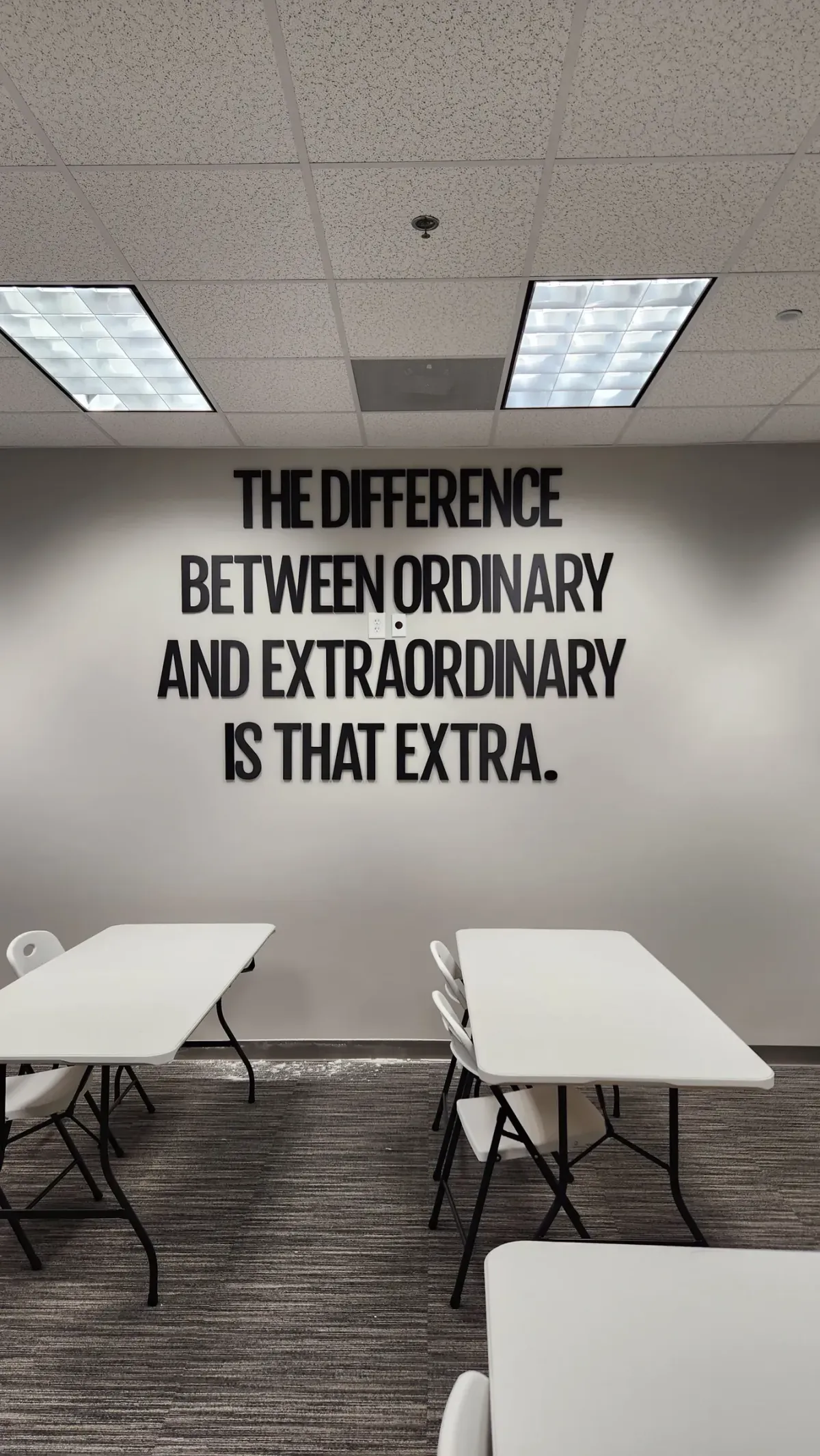 Dimensional wall lettering. Cut, spaced, and mounted flat across a training room wall