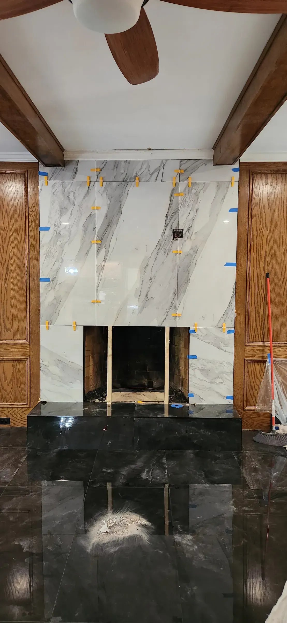 Fireplace surround. Book-matched slab, two fireplaces in the same house