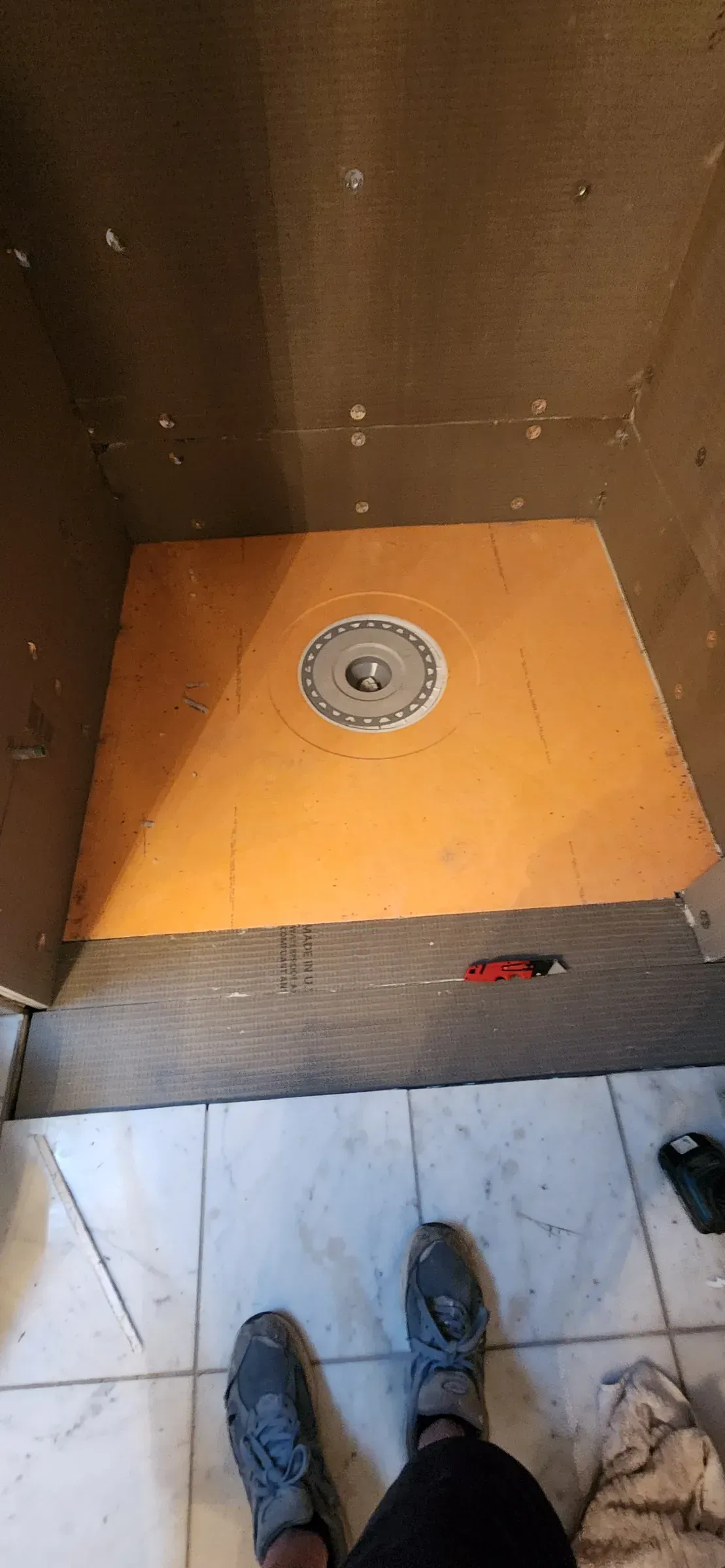 Waterproofed pan. Bonded flange drain and a pre-sloped base before a single tile goes down