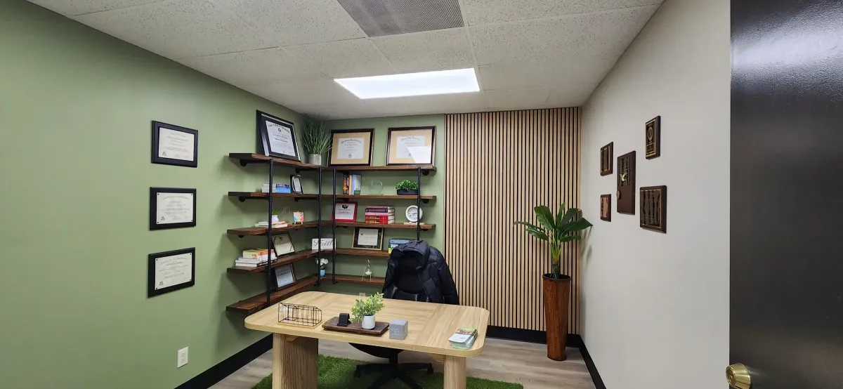 Finished medical office with slat wood wall and pipe shelving