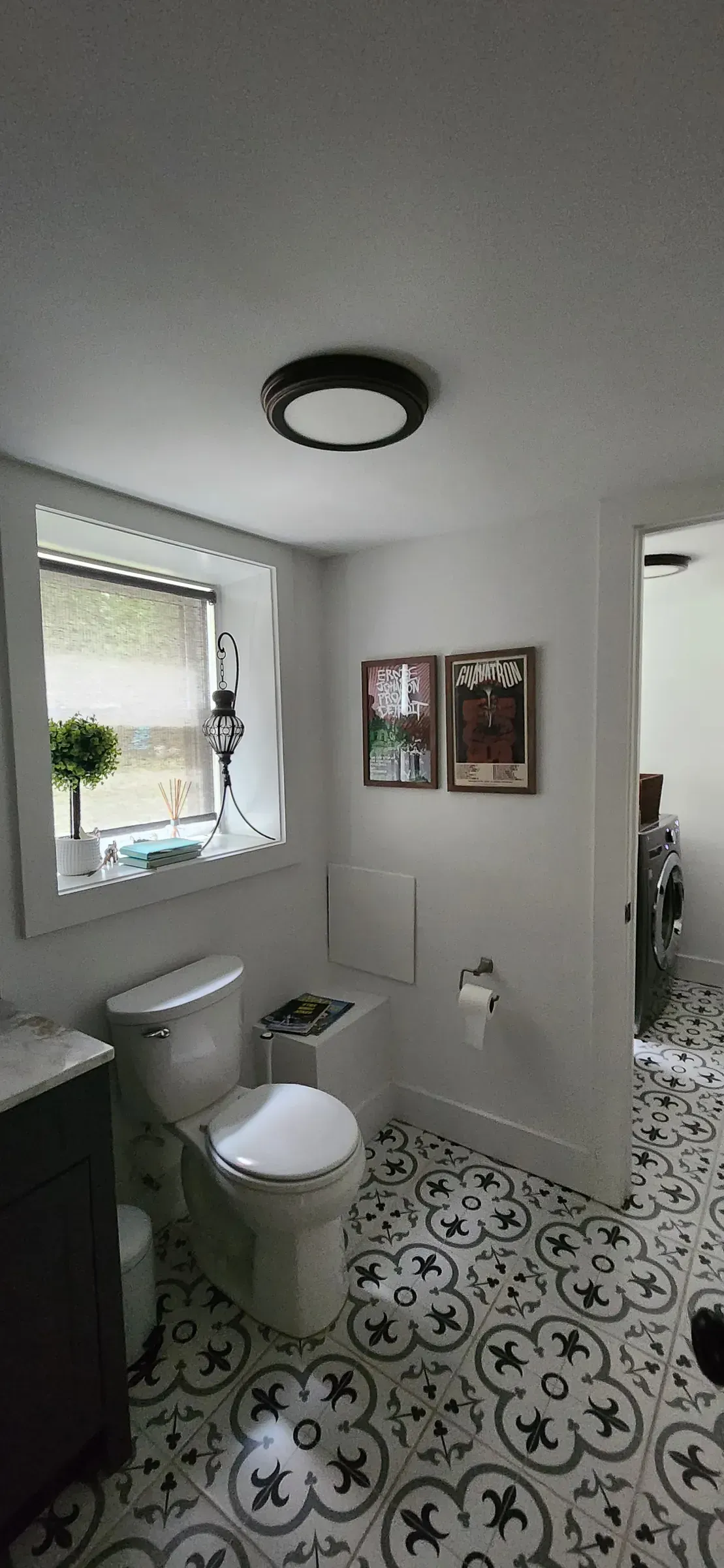 Pattern tile. Cut around the flange and into the doorway, where sloppy work shows