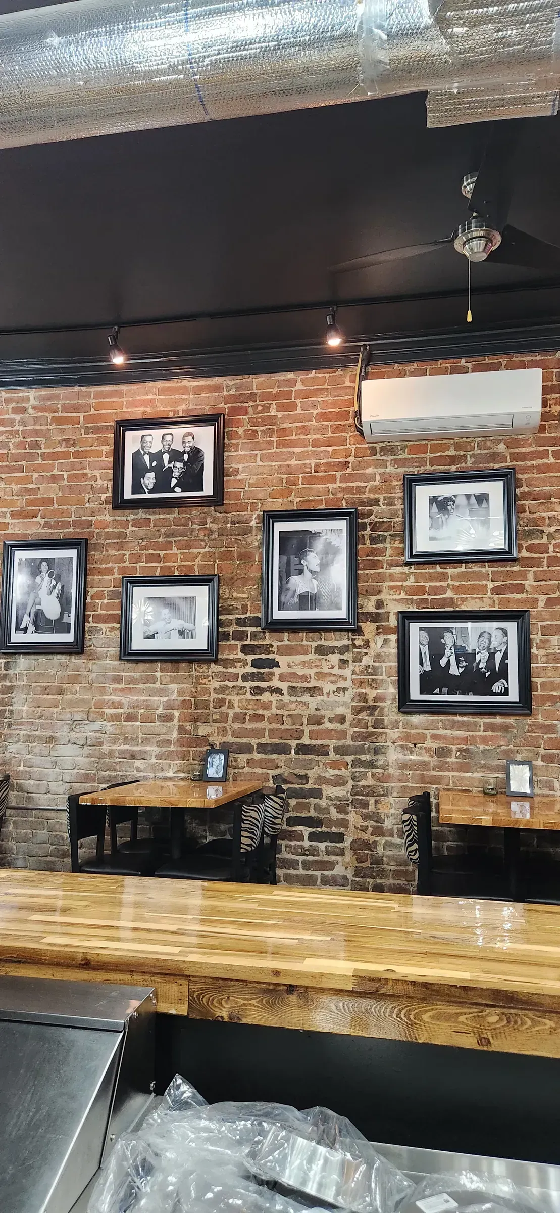 Framed photo wall. Hung level over the butcher block bar top