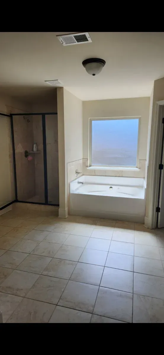 Dated garden tub alcove before conversion