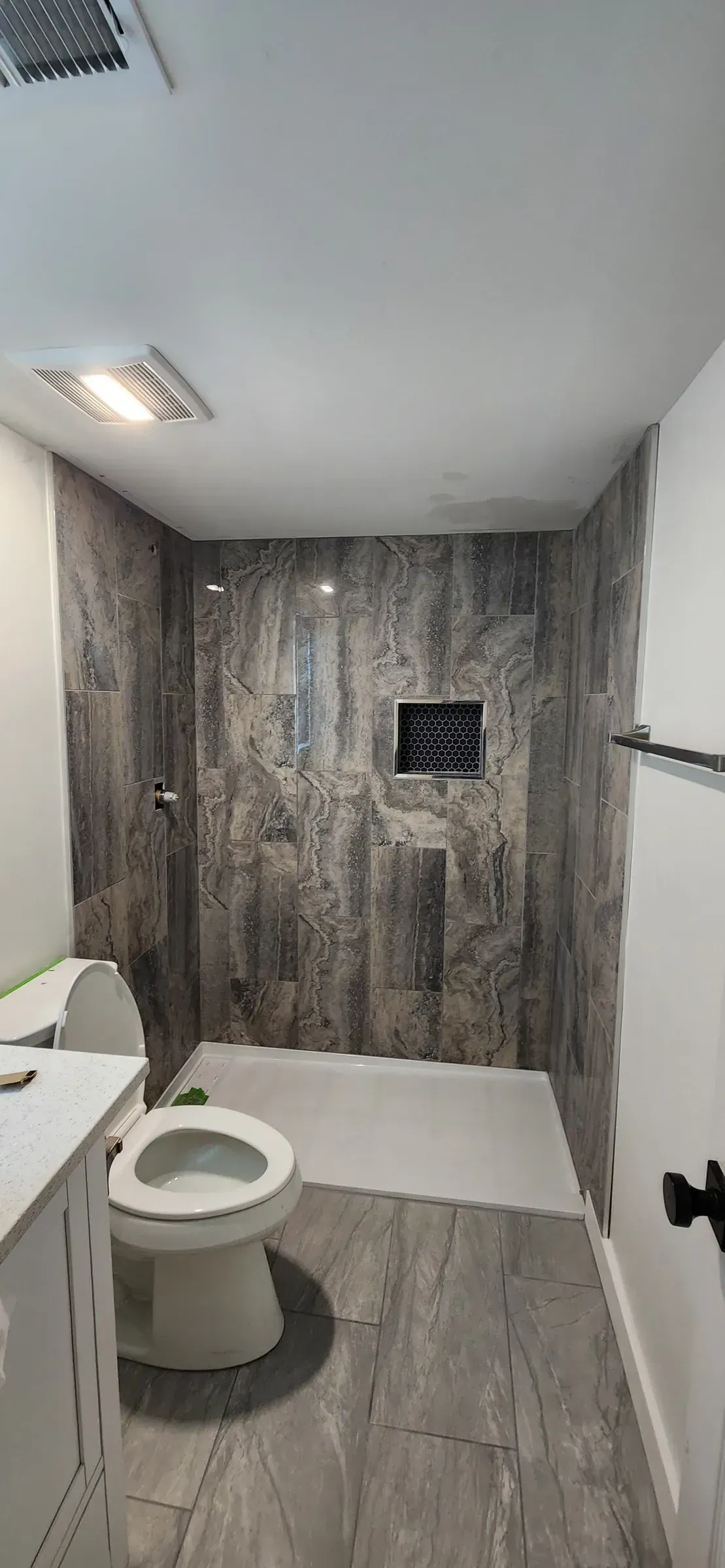 Walk-in shower after tub-to-shower conversion