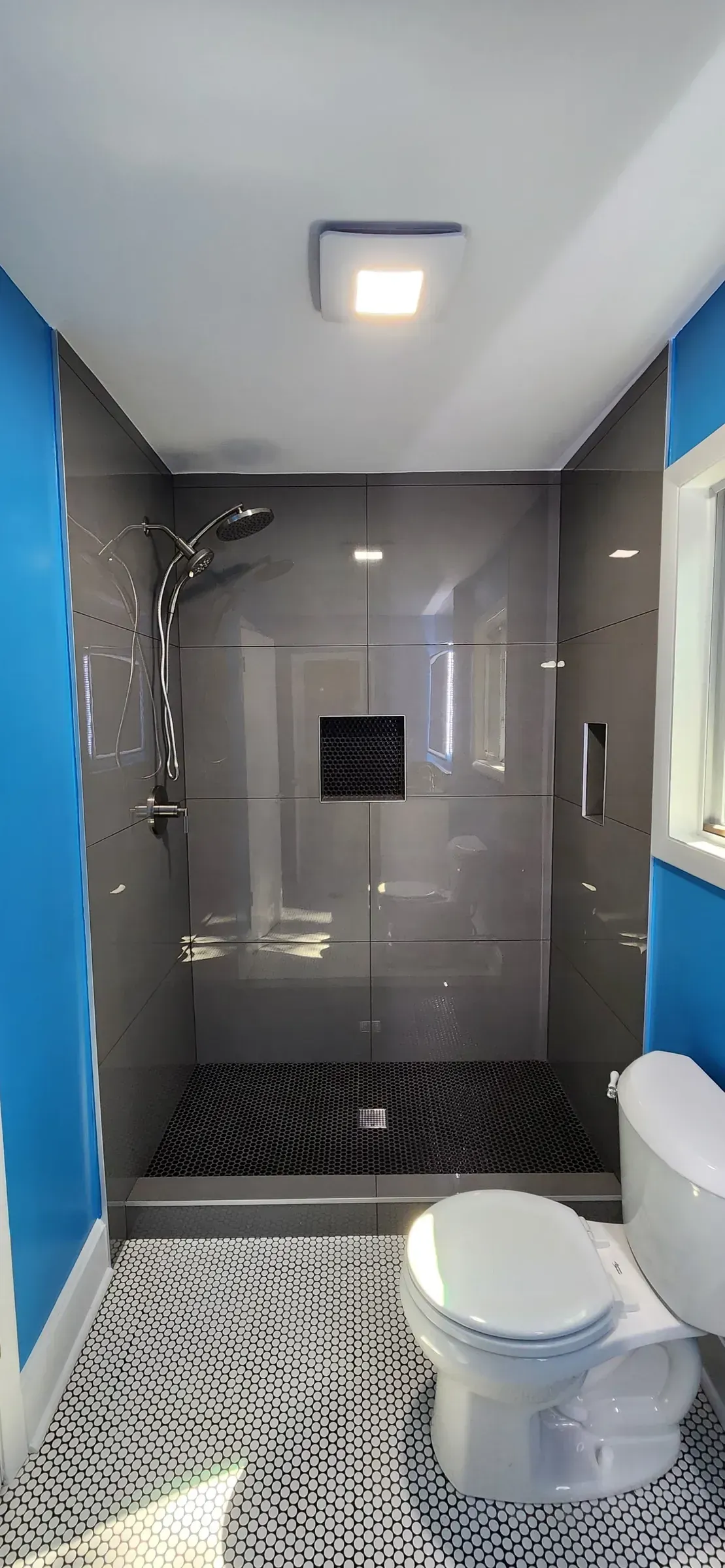 Finished walk-in shower built in a former garden tub alcove in Tucker, Georgia