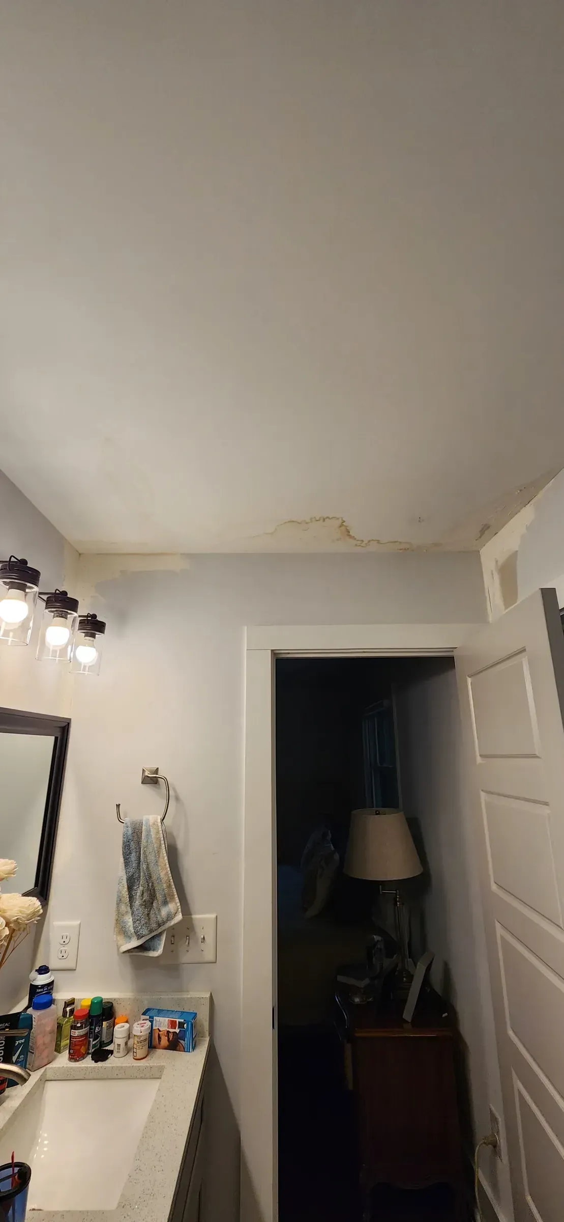 Water-stained ceiling caused by a failed shower above