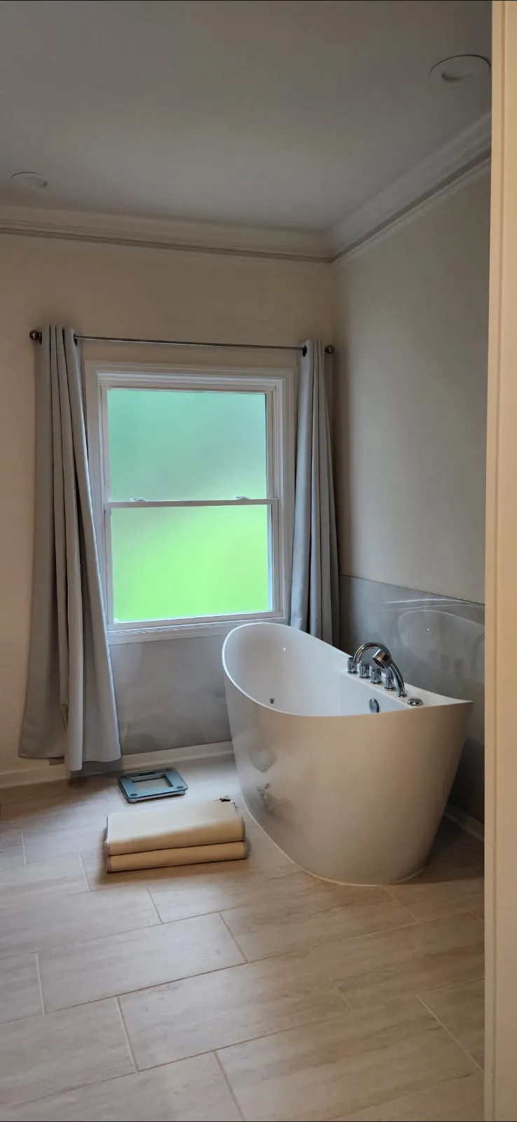 Finished freestanding soaking tub in a remodelled primary bathroom, Briarcliff Remodeling