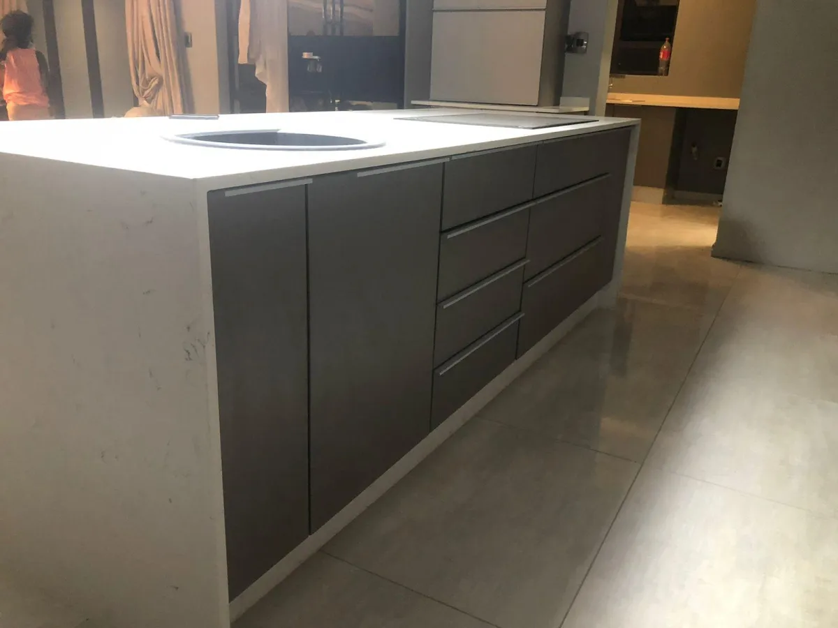 Kitchen cabinetry featuring almost invisible door handles.