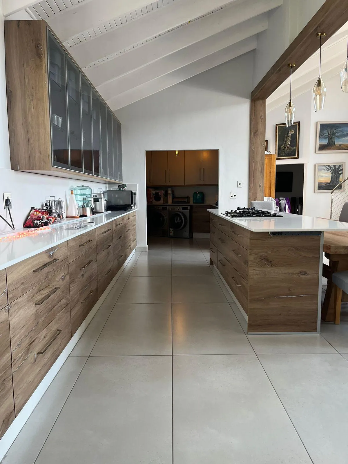 Custom cabinetry with glass doors and built-in stove space.