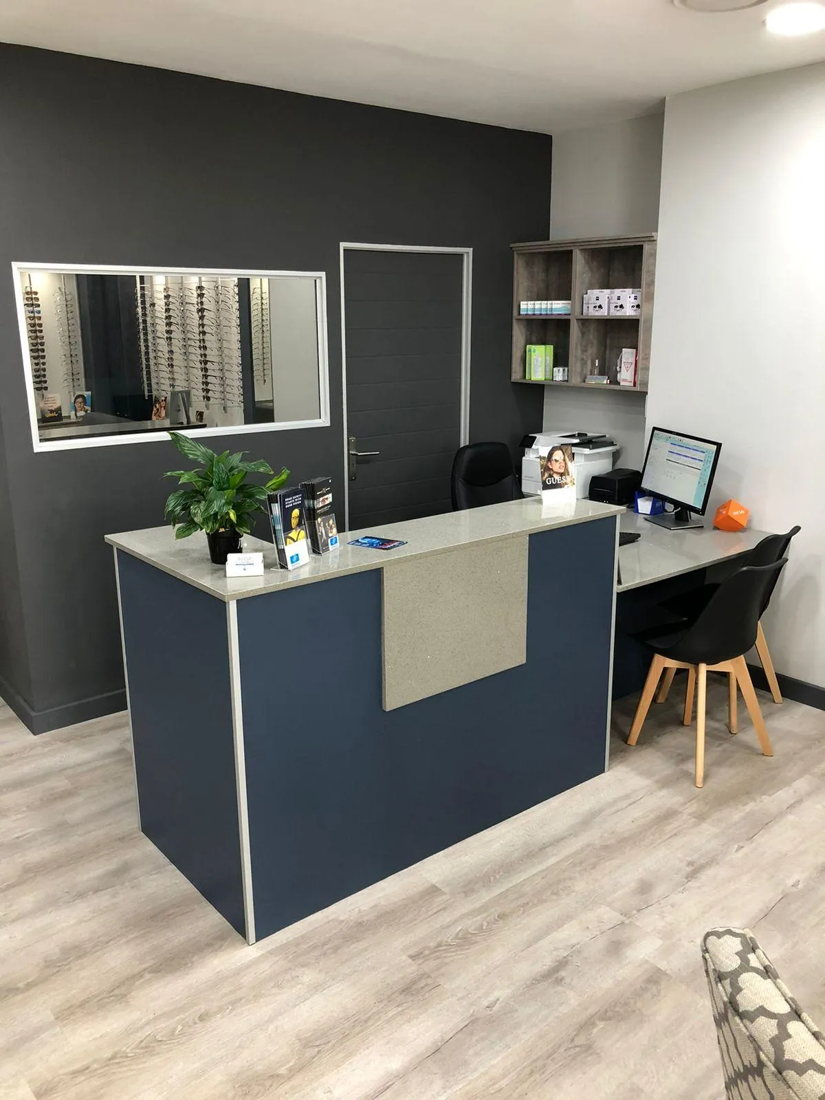 Modern dark blue office cupboard with built-in file shelves for organized storage.