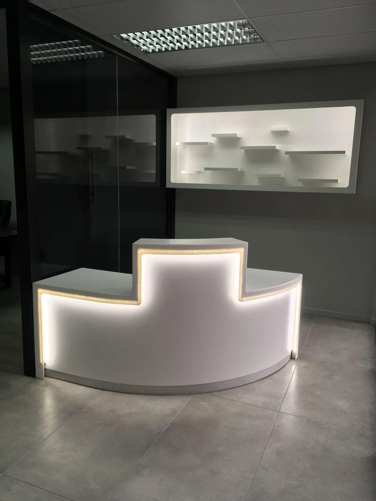 Modern white shop desk with LED lighting for an elegant and functional workspace.