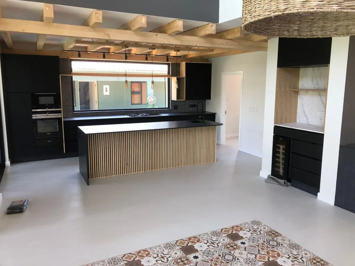Cabinetry with space for sink and flat panel finishes.