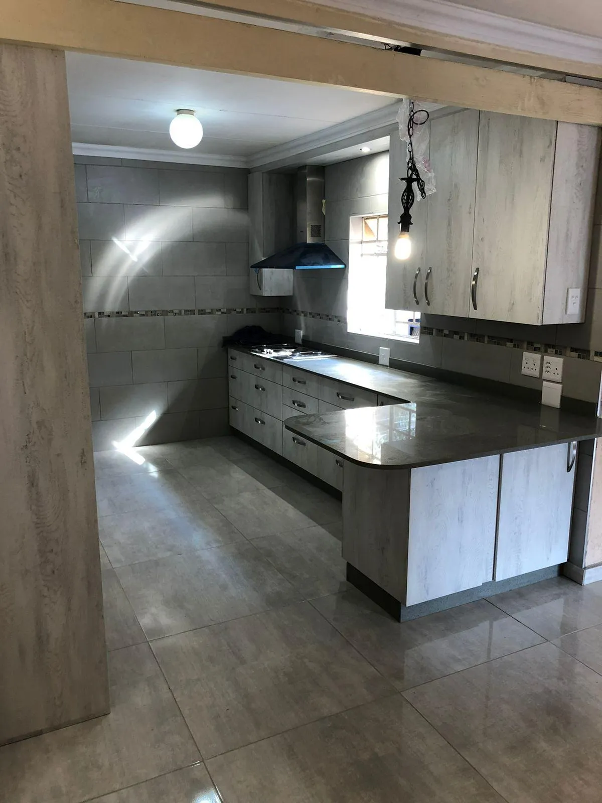 Modern kitchen cabinetry with upgraded door handles.